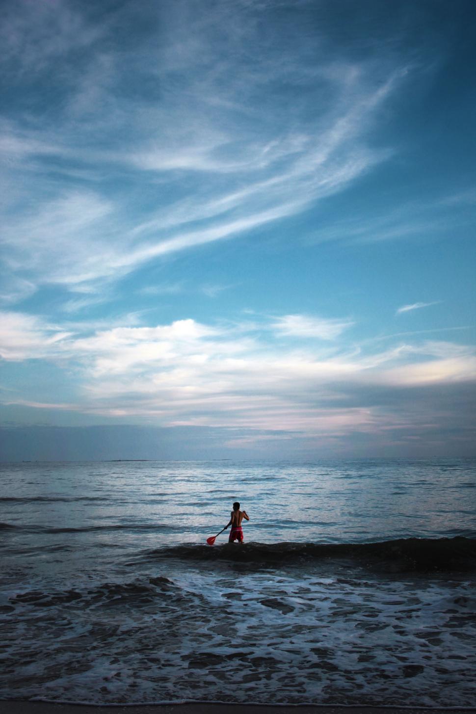 Free Image of Person Standing in Water at Beach 