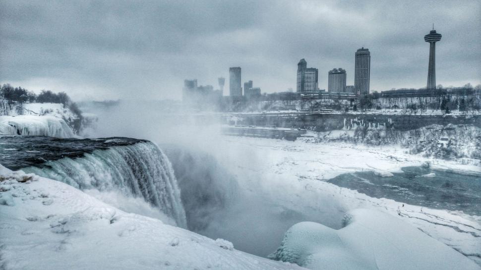 Free Image of Majestic Waterfall Overlooking City 