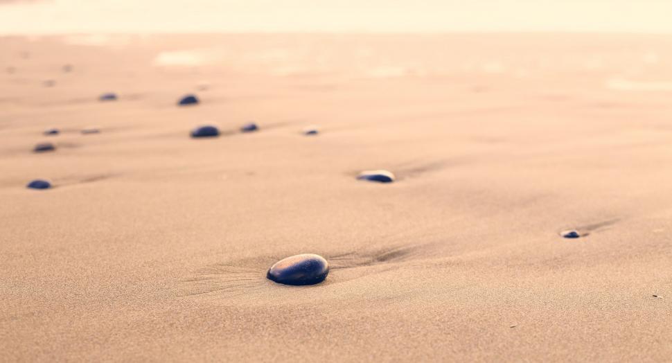 Free Image of Close Up of a Rock in the Sand 