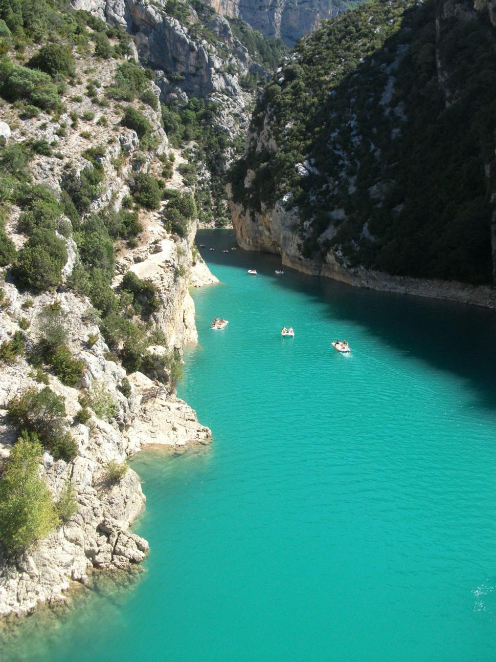 Free Image of Group of Boats Floating on Blue River 