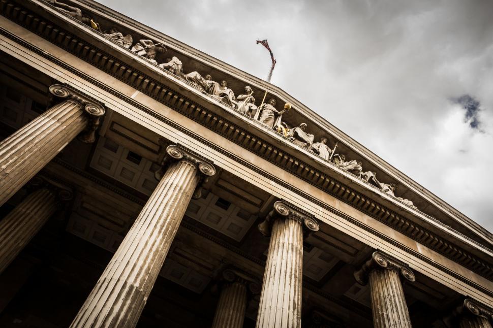 Free Image of Tall Building With Large Pillars 