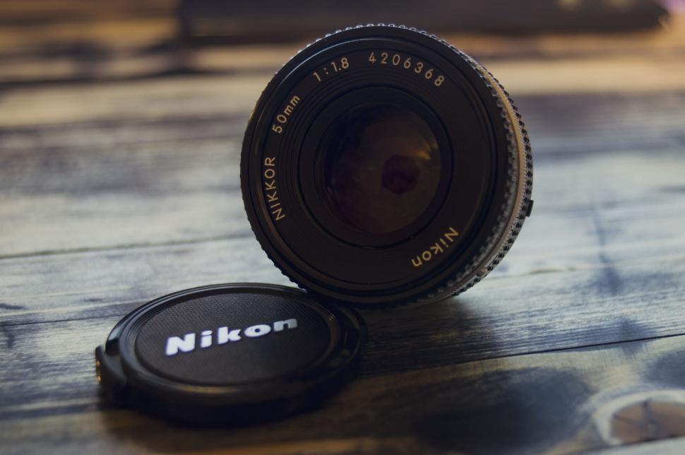 Free Image of Camera Lens on Wooden Table 
