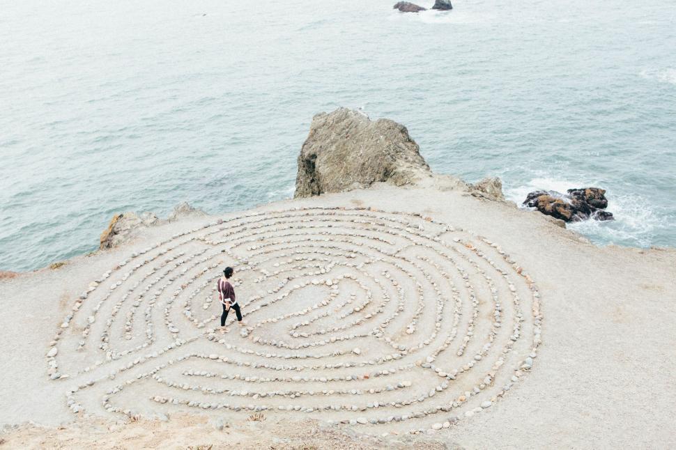 Free Image of Man Standing in Maze on Beach 
