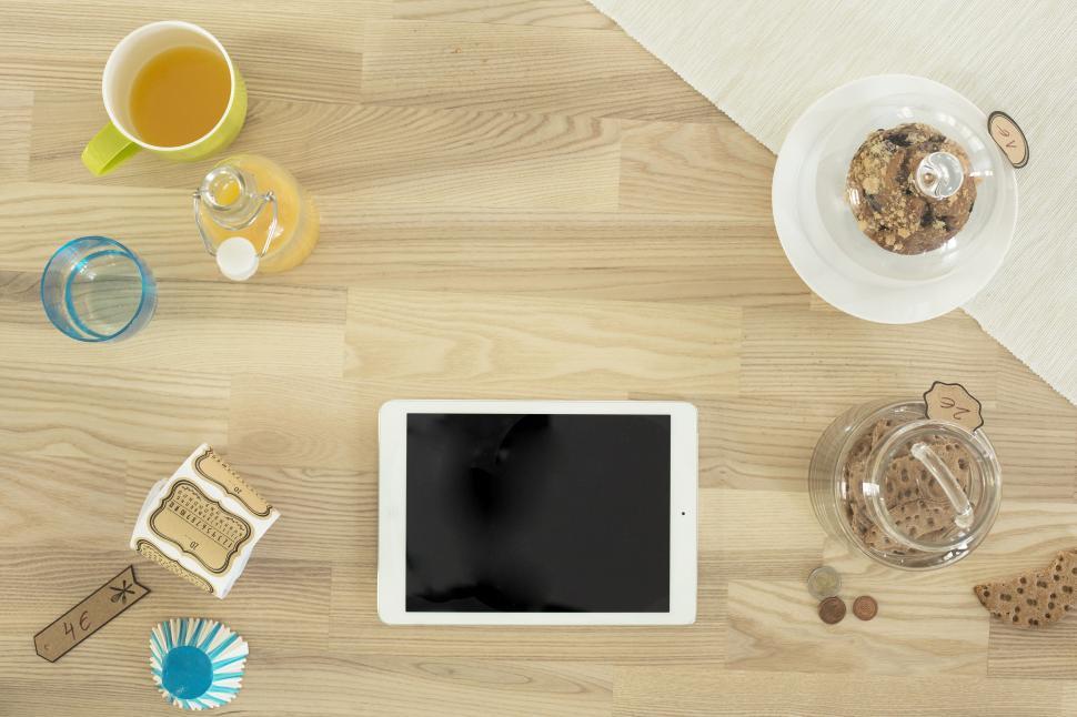 Free Image of Tablet Computer on Wooden Table 