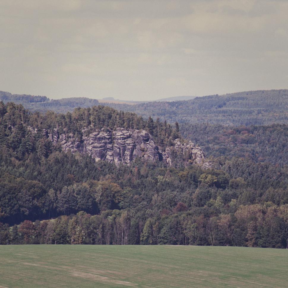 Free Image of Green Field With Mountain Background 