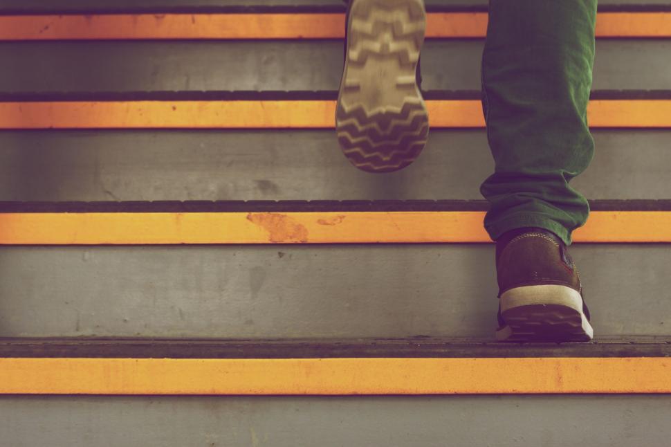 Free Image of Person Climbing Stairs in a Building 