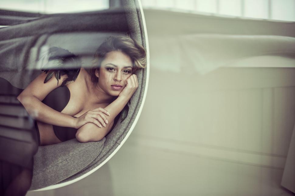 Free Image of Woman Sitting in a Car Looking Out the Window 