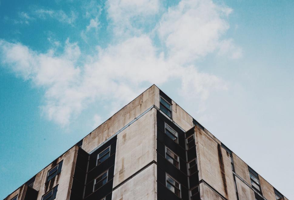 Free Image of Tall Building With Windows Against Sky Background 