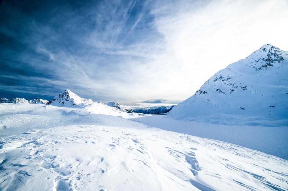 Free Image of Snowboarder Descending Snowy Mountain 