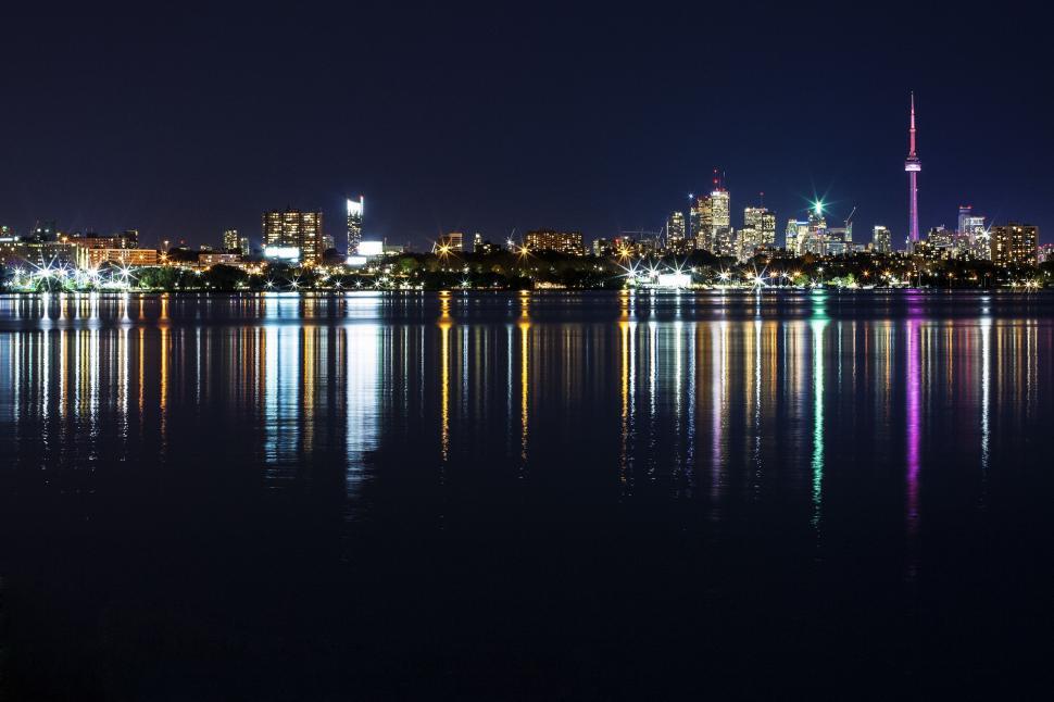 Free Image of City Skyline Illuminated Across Water at Night 