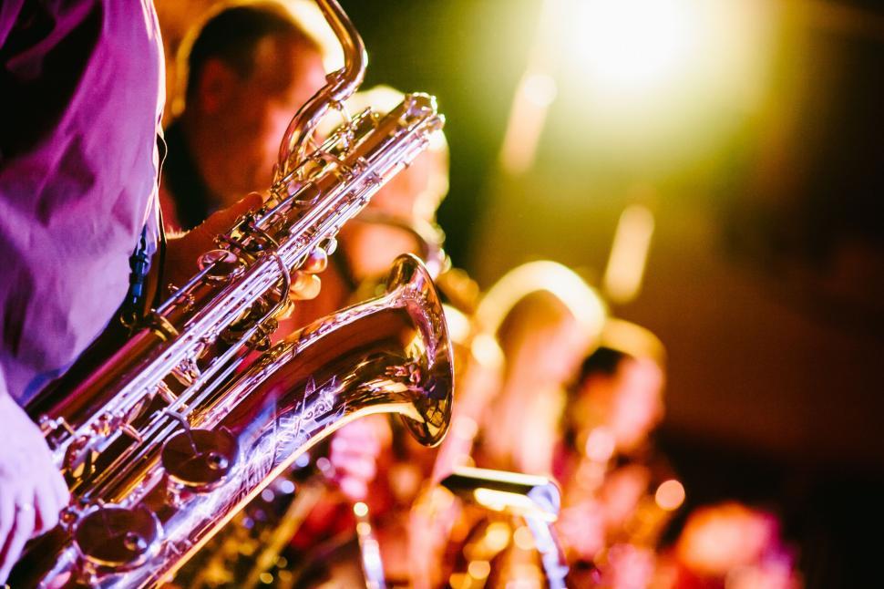 Free Image of Group of People Playing Instruments on Stage 
