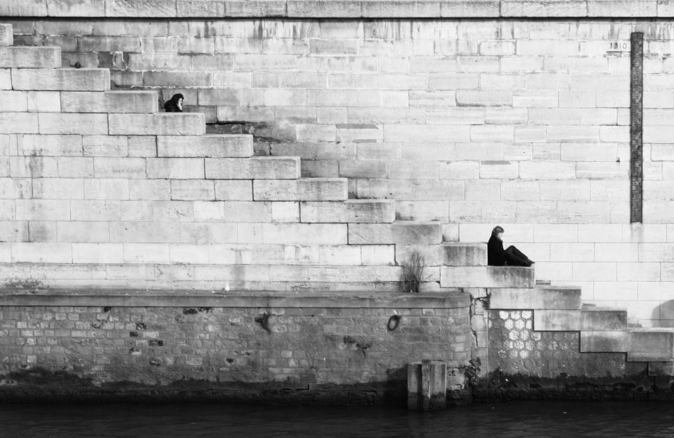 Free Image of Person Sitting on a Bench 