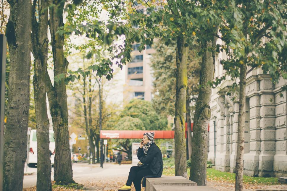 Free Image of Person Sitting on Bench in Park 