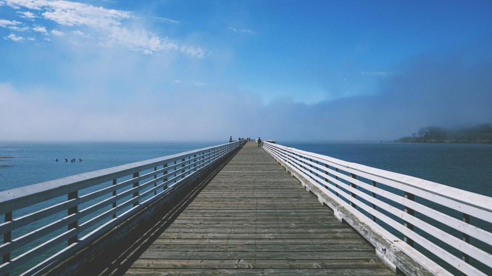 Free Image of Long Pier Extending Into the Ocean 