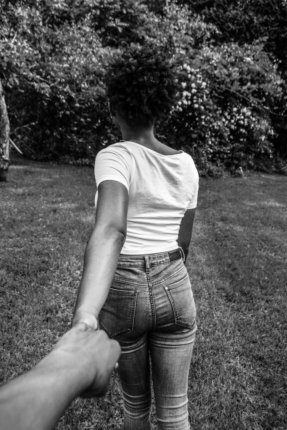 Free Image of Woman Holding Hands With Man in Field 