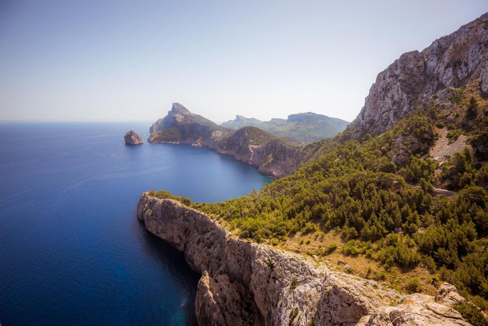 Free Image of Majestic Mountains Surrounding a Vast Body of Water 