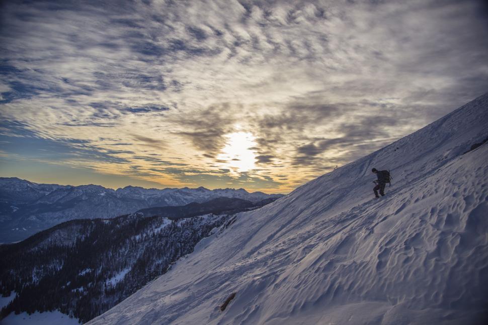 Free Image of Person Skiing Down Snowy Mountain 