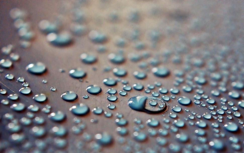 Free Image of Close-Up of Water Droplets on Surface 