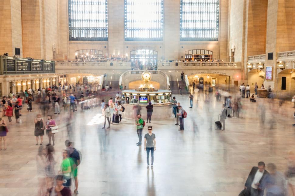 Free Image of Large Group of People Walking Around Train Station 