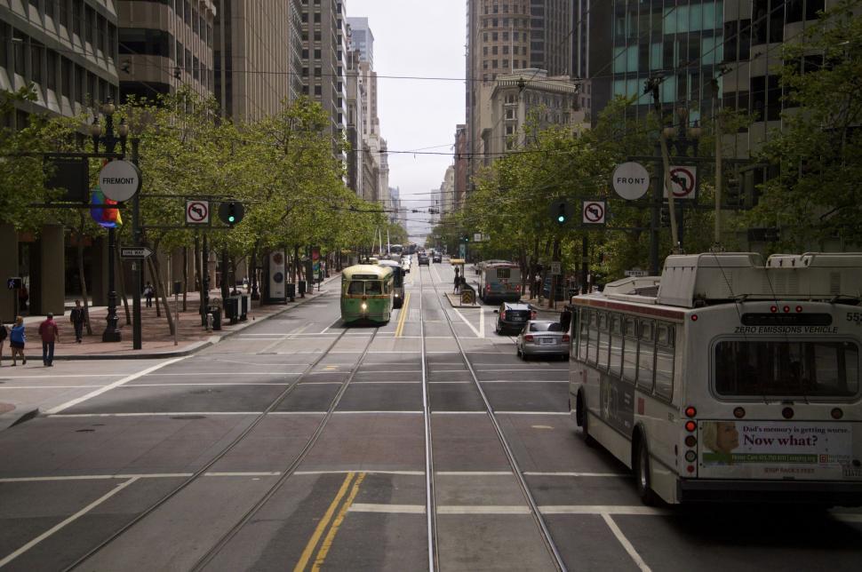 Free Image of Bustling City Street With Traffic and Tall Buildings 