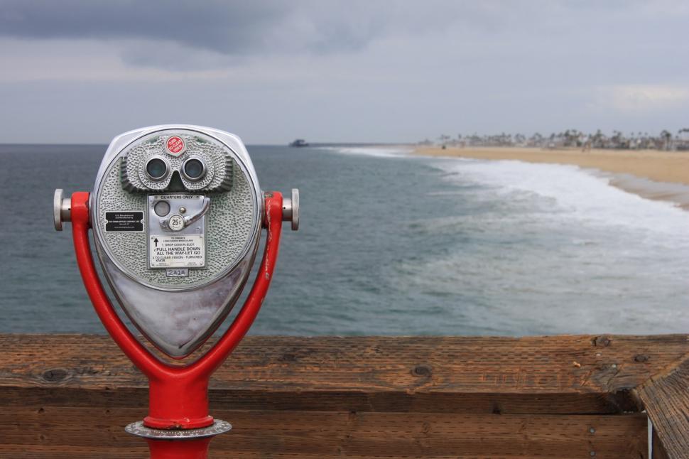 Free Image of Red and Silver Coin Meter on Wooden Fence 