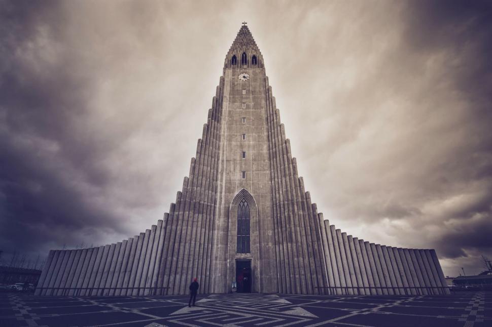 Free Image of Tall Building With Clock on Side 