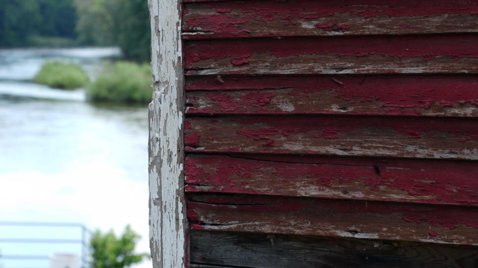 Free Image of Close Up of a Red Building by River 