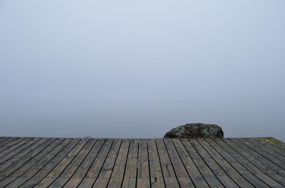 Free Image of Large Rock on Wooden Floor 
