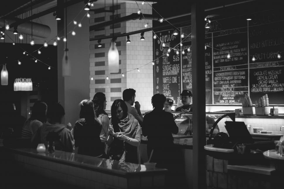 Free Image of Group of People Dining at Restaurant Table 