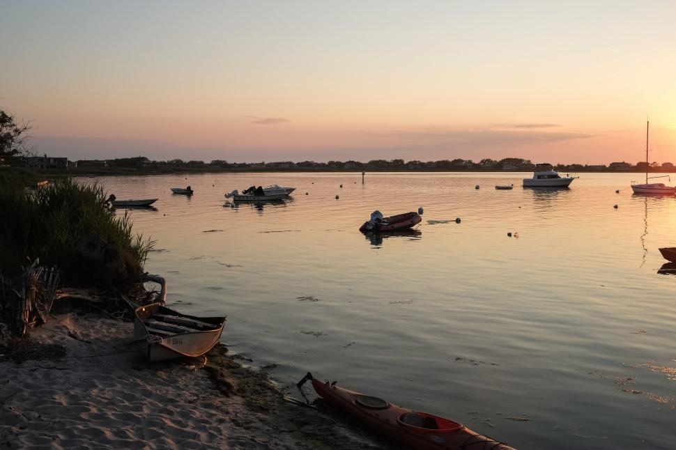 Free Image of Group of Boats Floating on Top of a Lake 
