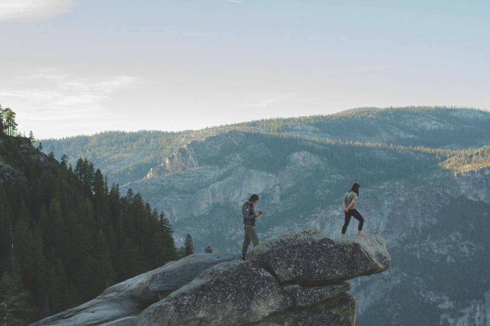 Free Image of Couple Standing on Cliff Edge 