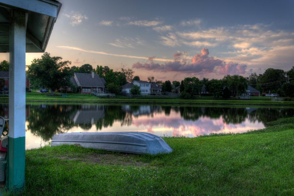 Free Image of Boat Resting on Grass by Waters Edge 