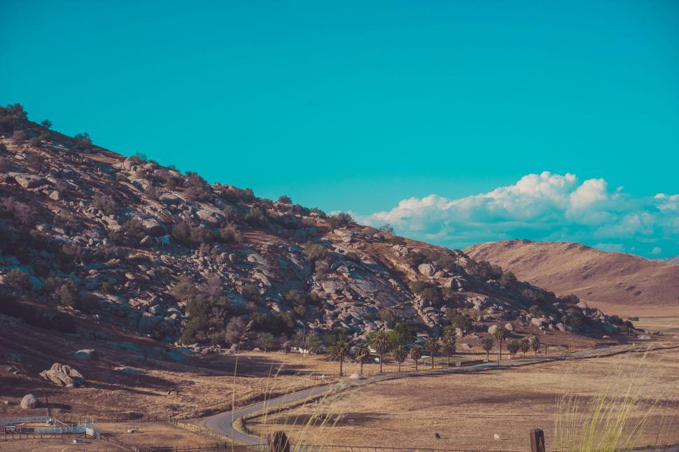 Free Image of Mountain Road Passing Through Rugged Landscape 