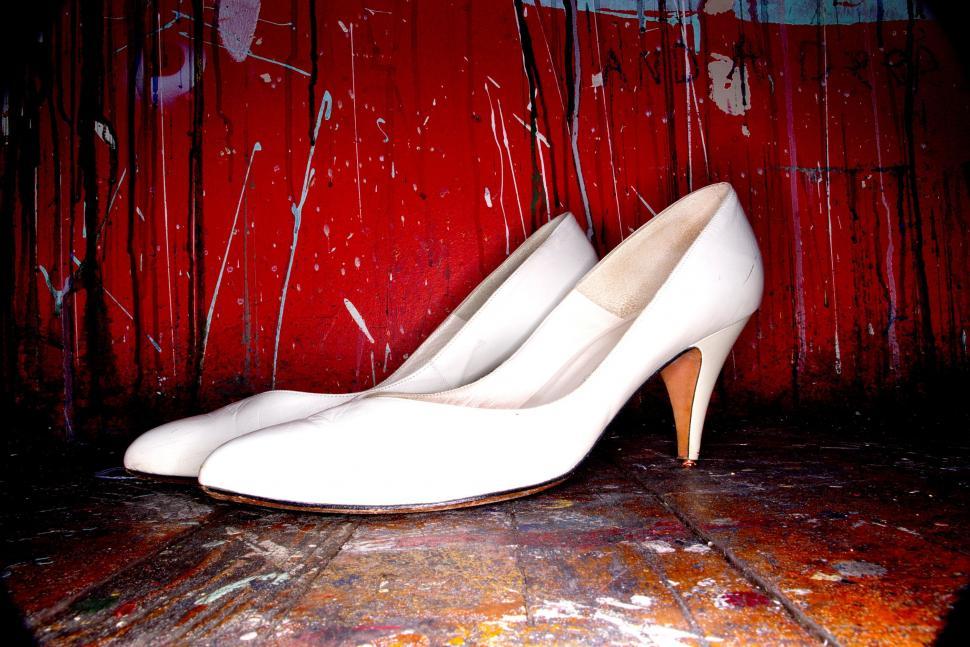 Free Image of White Shoes on Wooden Floor 
