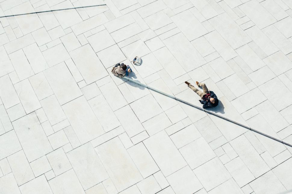 Free Image of Two People Sitting on a Bench 