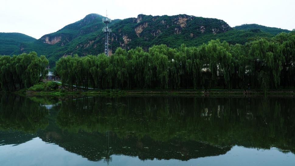 Free Image of Mountain Lake Surrounded by Trees 