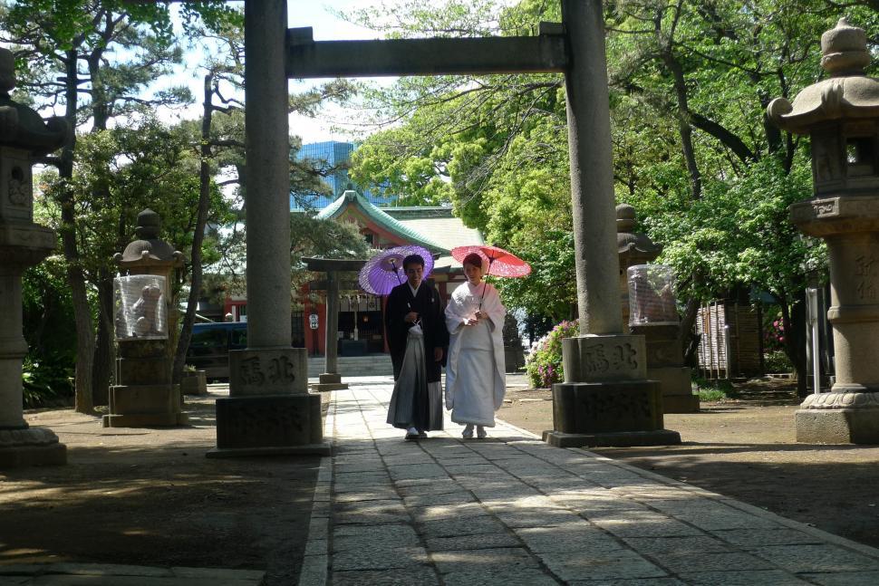 Free Image of Couple Holding Umbrellas in the Rain 