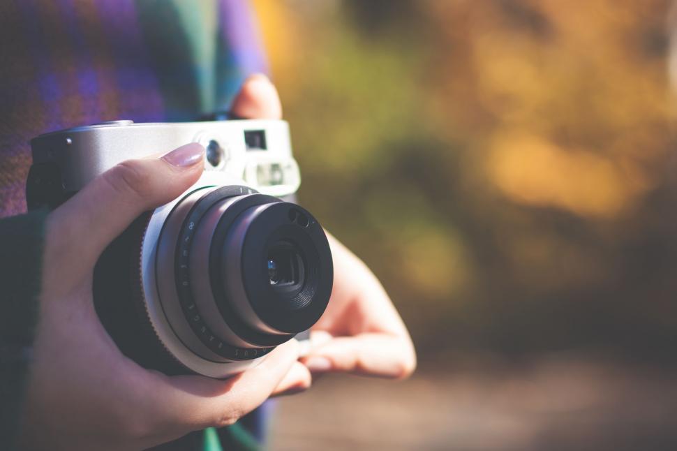 Free Image of Person Holding Camera in Hands 