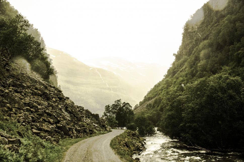 Free Image of A Black and White Photo of a Dirt Road 