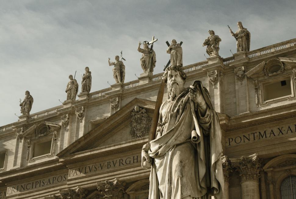 Free Image of Statue Stands in Front of Building 