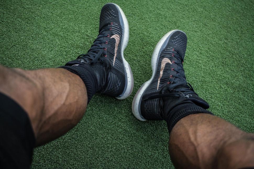 Free Image of Close Up of Persons Feet on Green Carpet 
