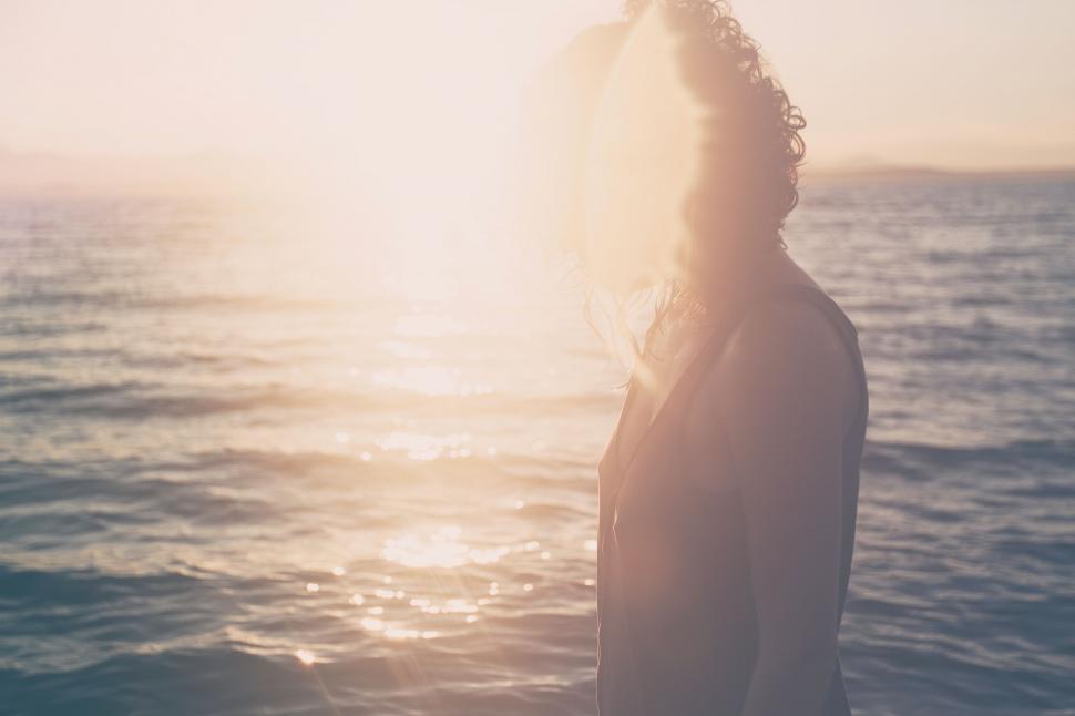 Free Image of Person Standing on Boat in Water 