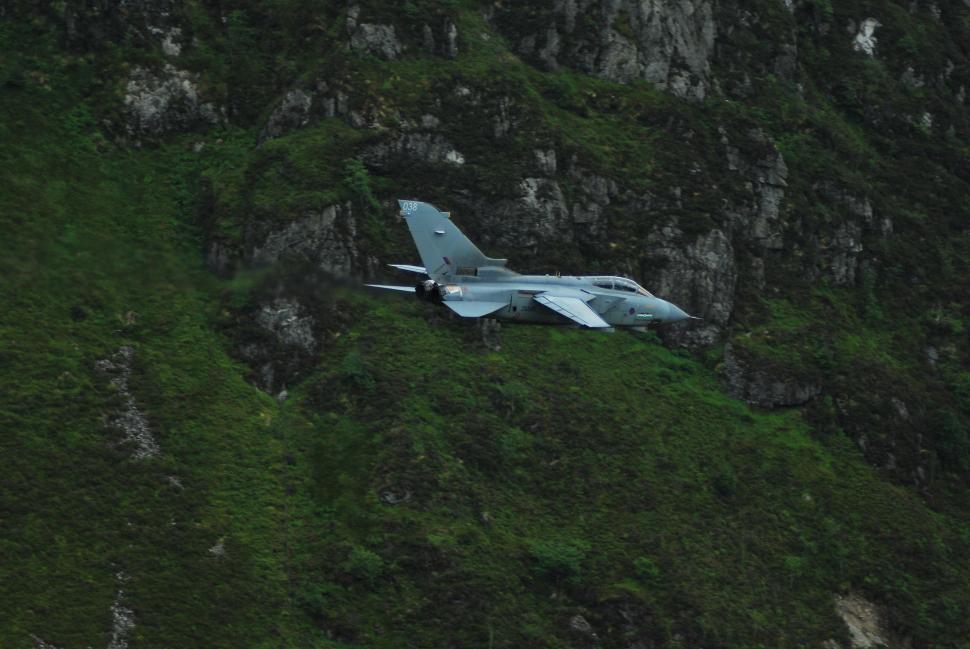 Free Image of Small Plane Flying Over Mountain 