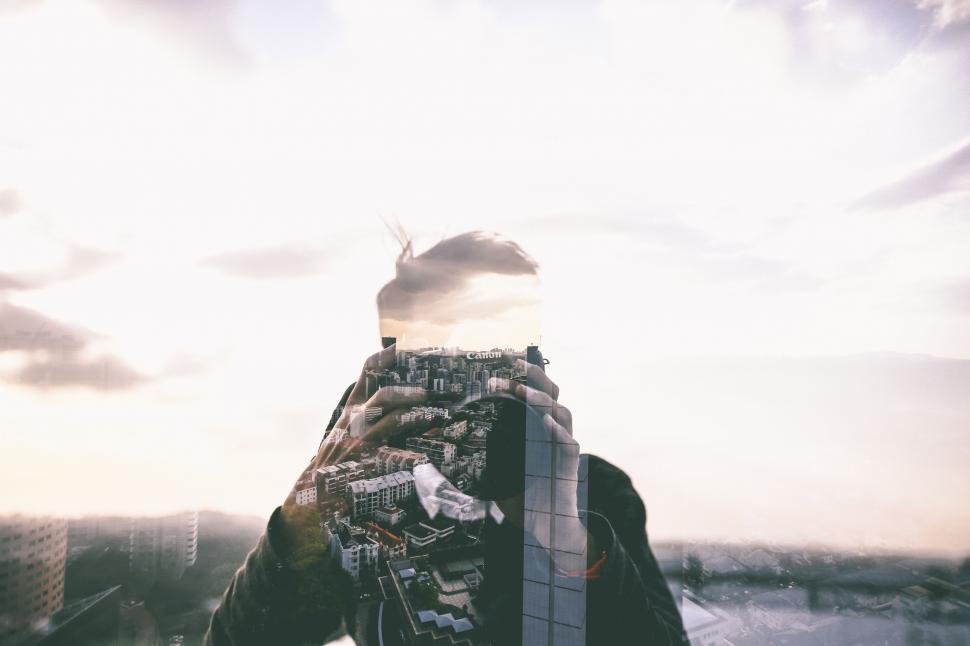 Free Image of Person Standing on Top of Tall Building 