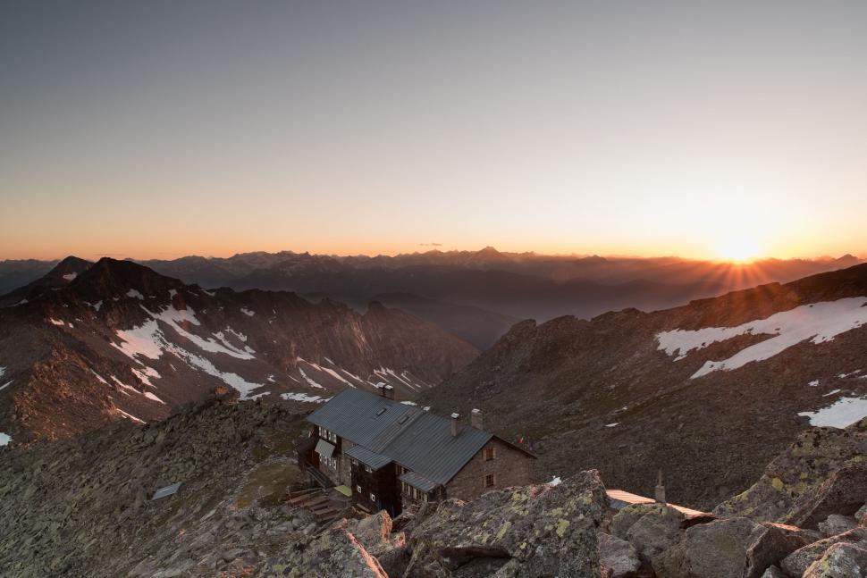 Free Image of Sun Setting Over Mountain Range 