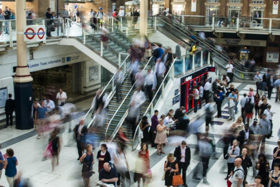 Free Image of Crowd of People Walking Around a Train Station 