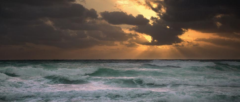 Free Image of Vast Water Body Under Cloudy Sky 