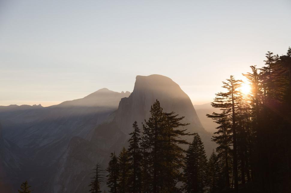 Free Image of Majestic Mountain Overlooking Forest of Trees 