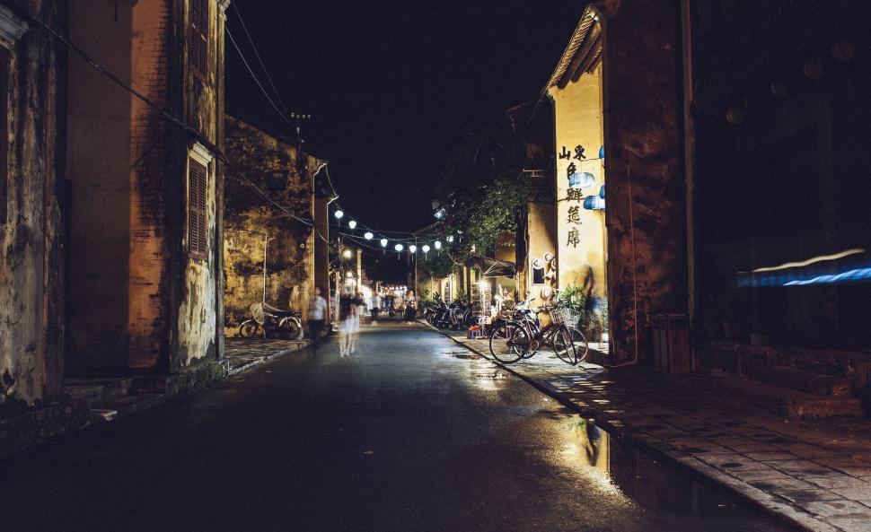 Free Image of Dark Street With Bikes Parked 