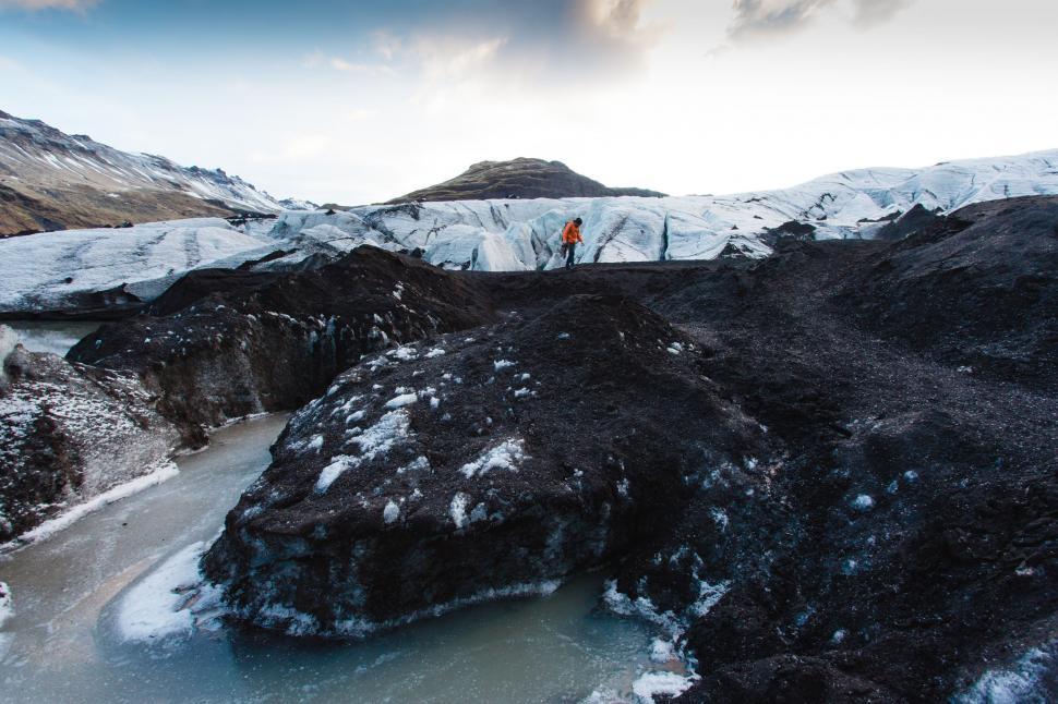 Free Image of Group of People Standing on Top of Snow Covered Mountain 